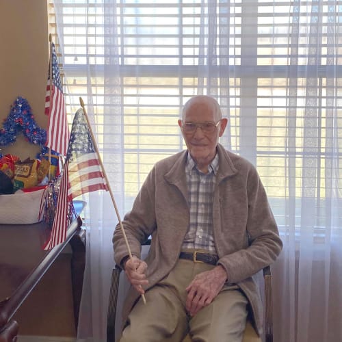 Resident with an American flag at Canoe Brook Assisted Living in Duncan, Oklahoma