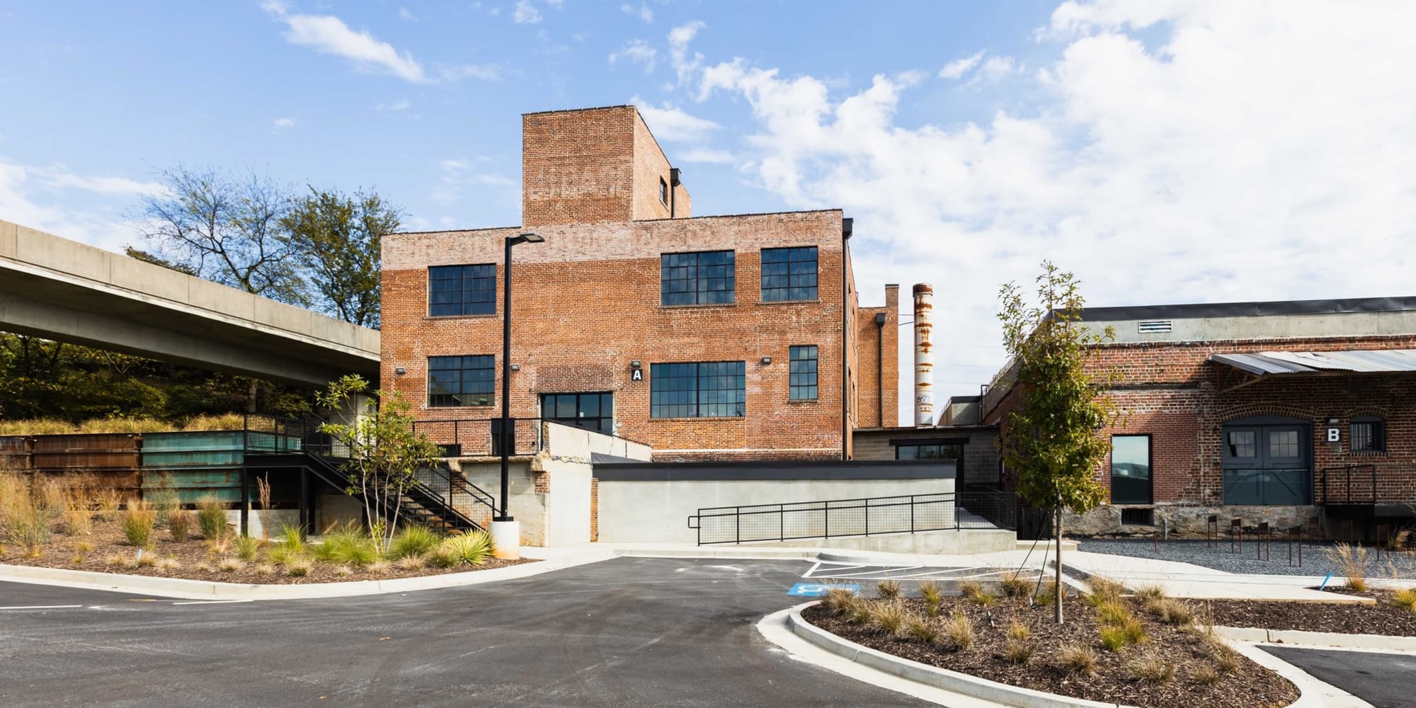 Exterior view of brick building and entrance at Lofts at Abrams Fixtures in Atlanta, Georgia