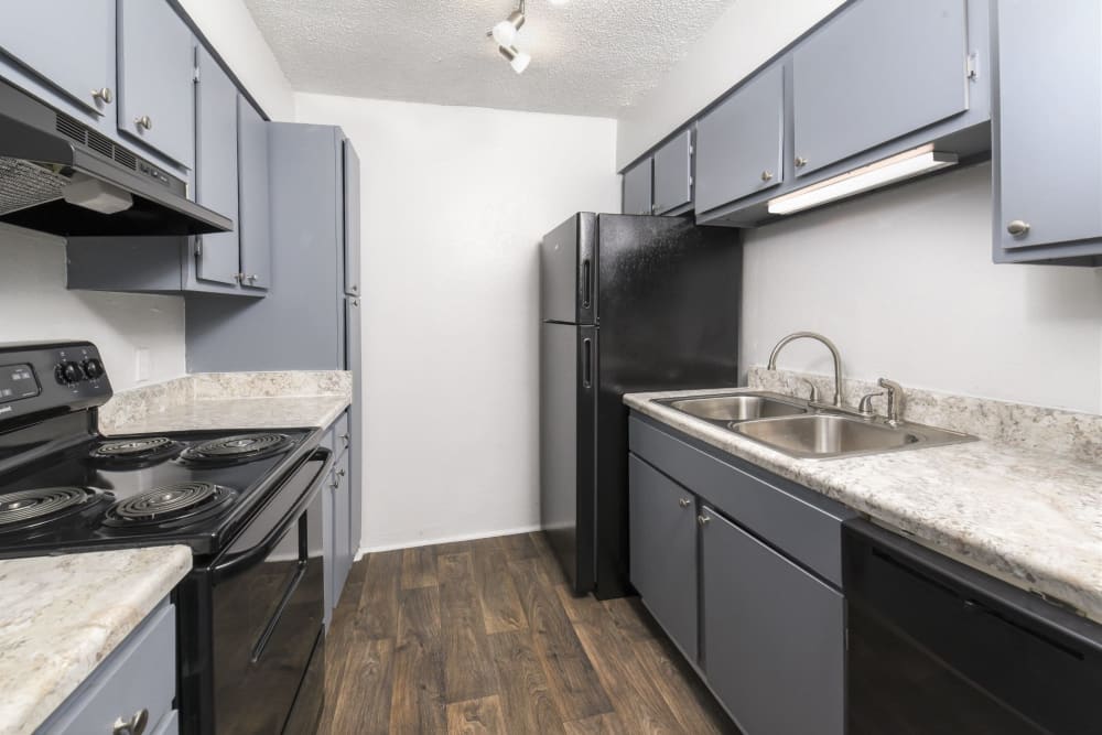 View of kitchen and counter at HighPointe Apartments in Birmingham, Alabama