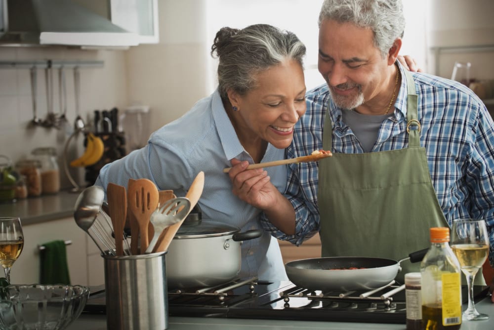 Rendering of residents cooking in their apartment at Los Pecos Senior Apartments in Las Vegas, Nevada