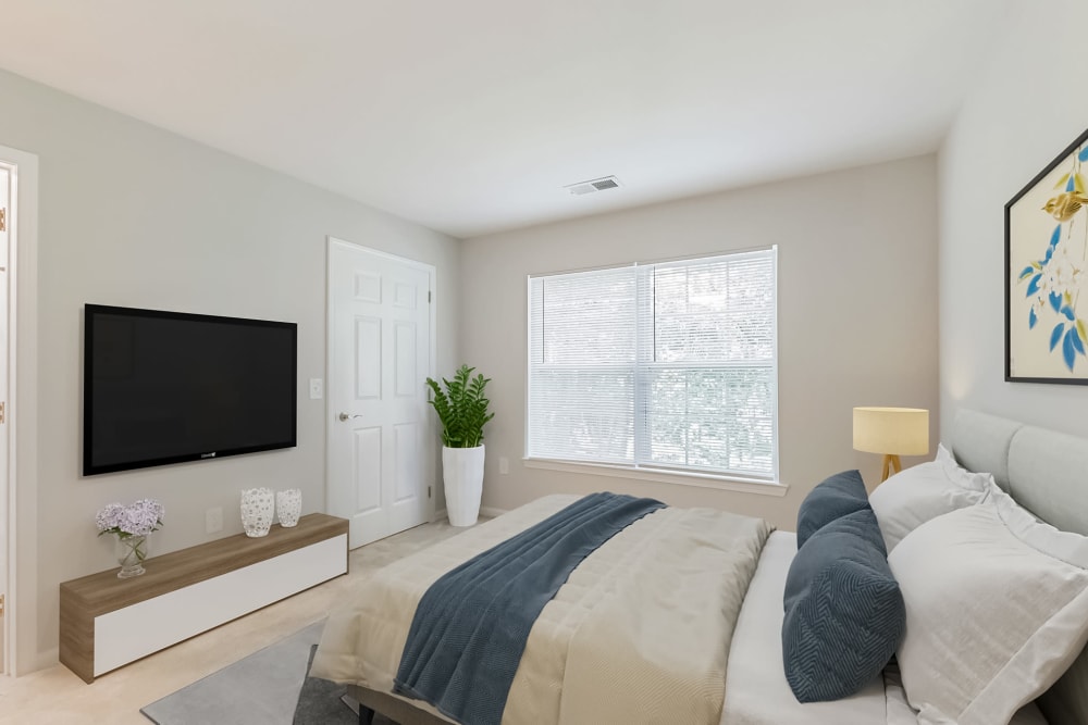 Large bedroom with window at Eagle Rock Apartments at Freehold in Freehold, New Jersey
