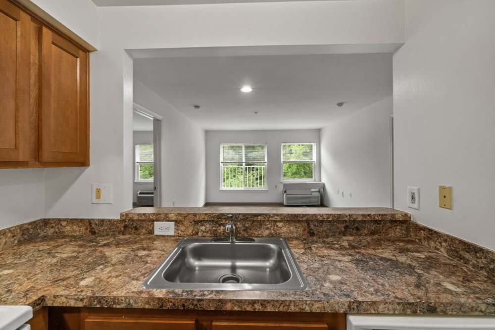 Kitchen overlooking the living room at Pin Oak Village in Bowie, Maryland