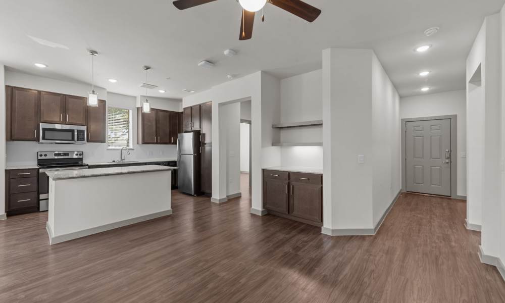Kitchen with hard-wood flooring at Opal Point at Kyle in Kyle,Texas