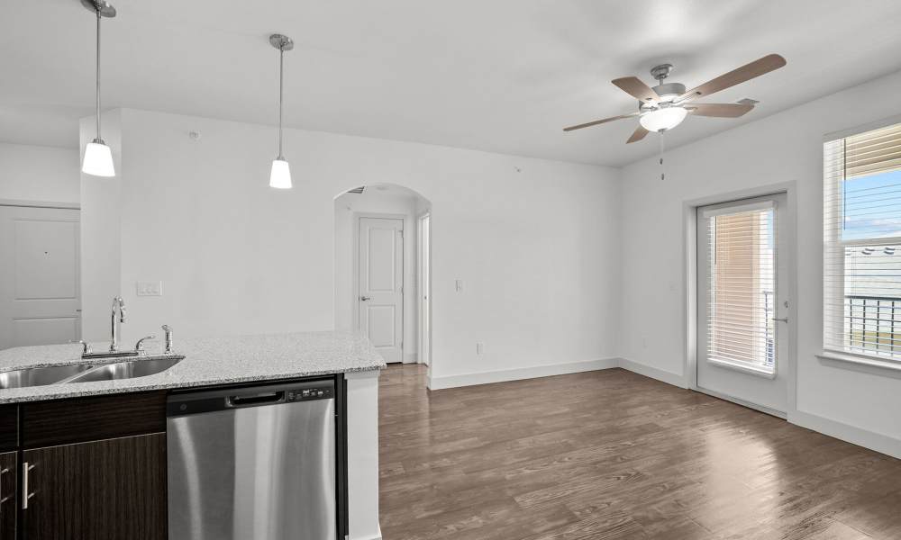 Kitchen with access to patio through glassdoor at Brook Hollow in Wichita Falls, Texas