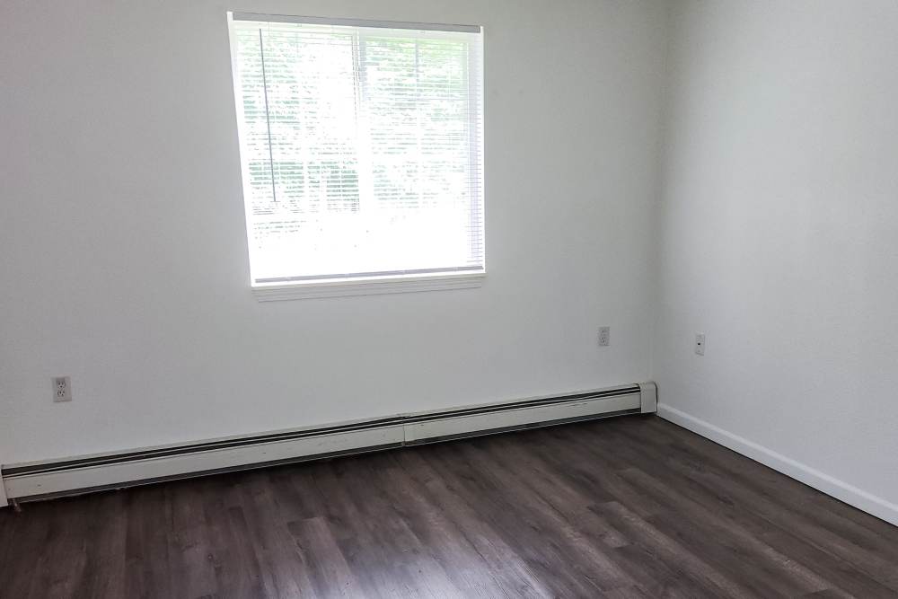 Unfurnished bedroom with window at Woodbrook Apartments in Three Rivers, Michigan