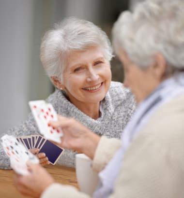 Seniors playing cards at Las Soleras Senior Living in Santa Fe, New Mexico