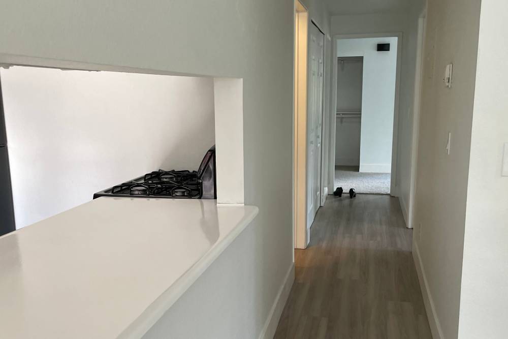 Combined view of living room and kitchen at The Rosewood Apartments in Vancouver, Washington