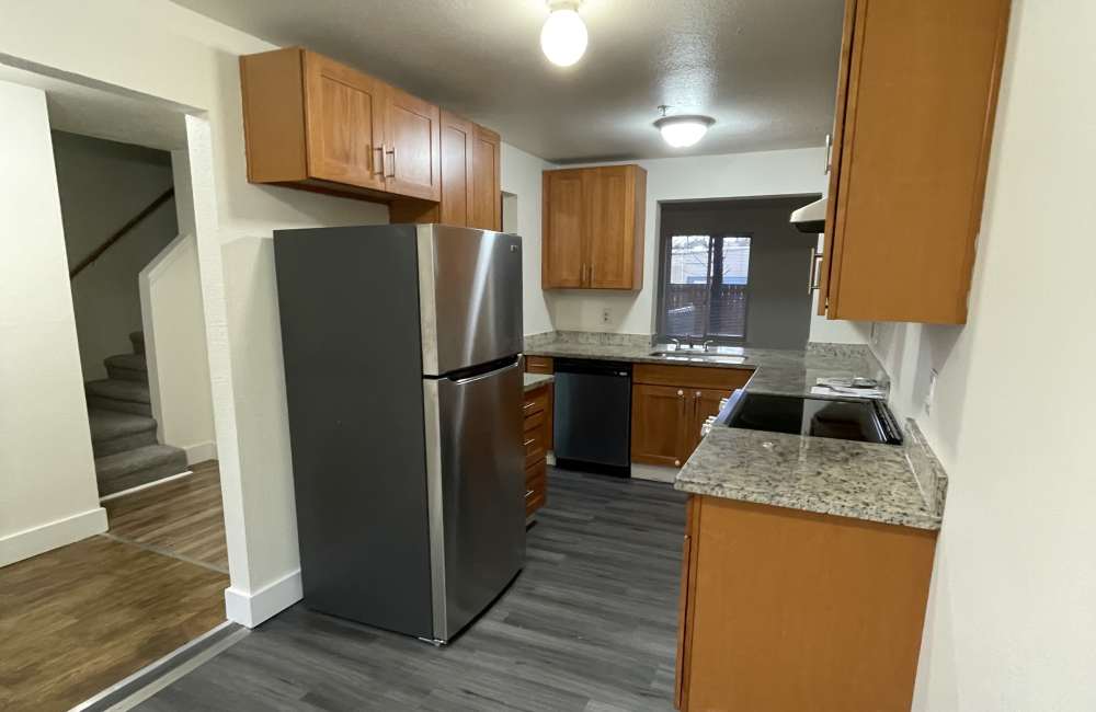 Kitchen with stainless-steel appliances at Evergreen Townhomes