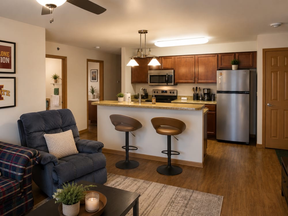 Modern kitchen with granite countertops at South Meadow in Ames, Iowa