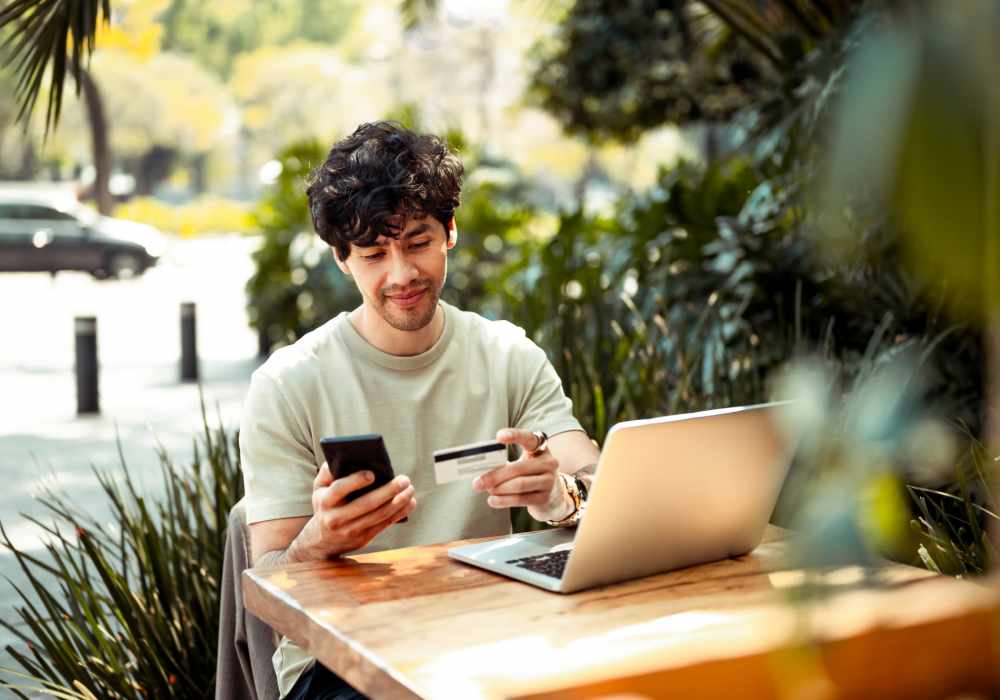 Charming outdoor workspace surrounded by lush landscaping at a cafe in an urban setting. High Point Crossing Apartments in Augusta, Georgia