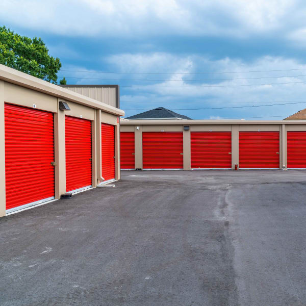 Outdoor storage units with red doors at StorQuest Express Self Service Storage in Sonora, California