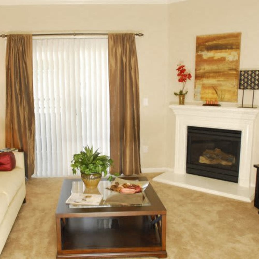 Living room with fireplace at Villas At Villaggio in Modesto, California