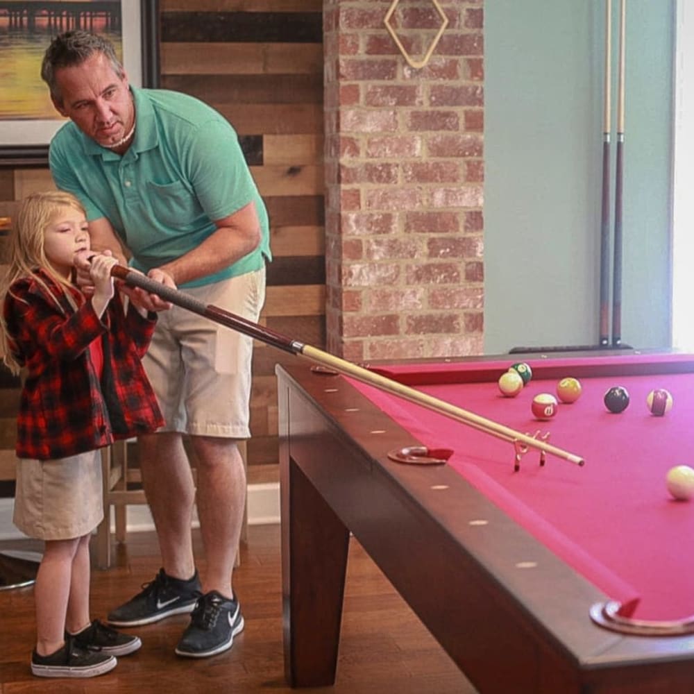 Residents play billiards at La Maison Of Saraland, Saraland, Alabama