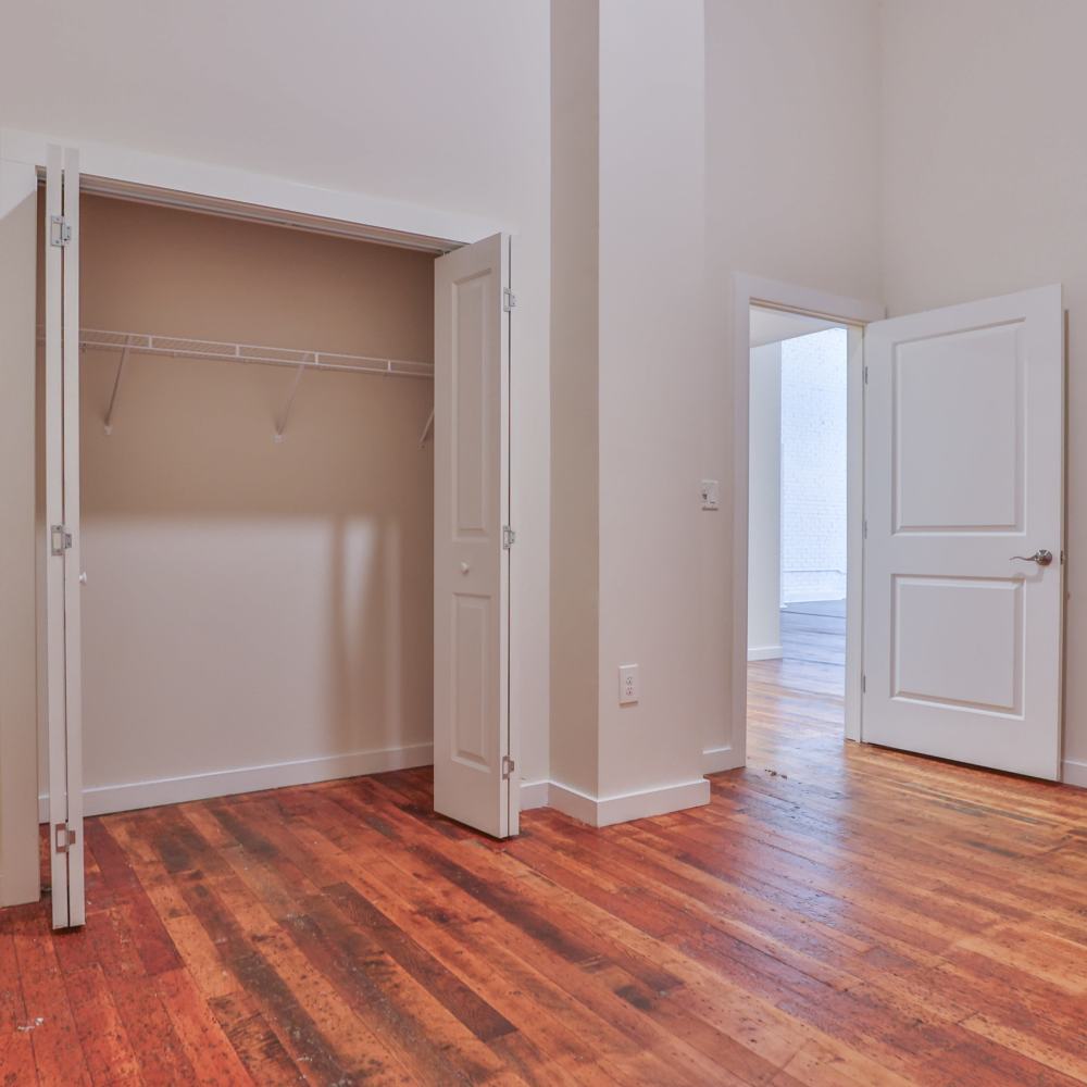 Well-lit apartment bedroom at Lofts at Inman Mills in Inman, South Carolina