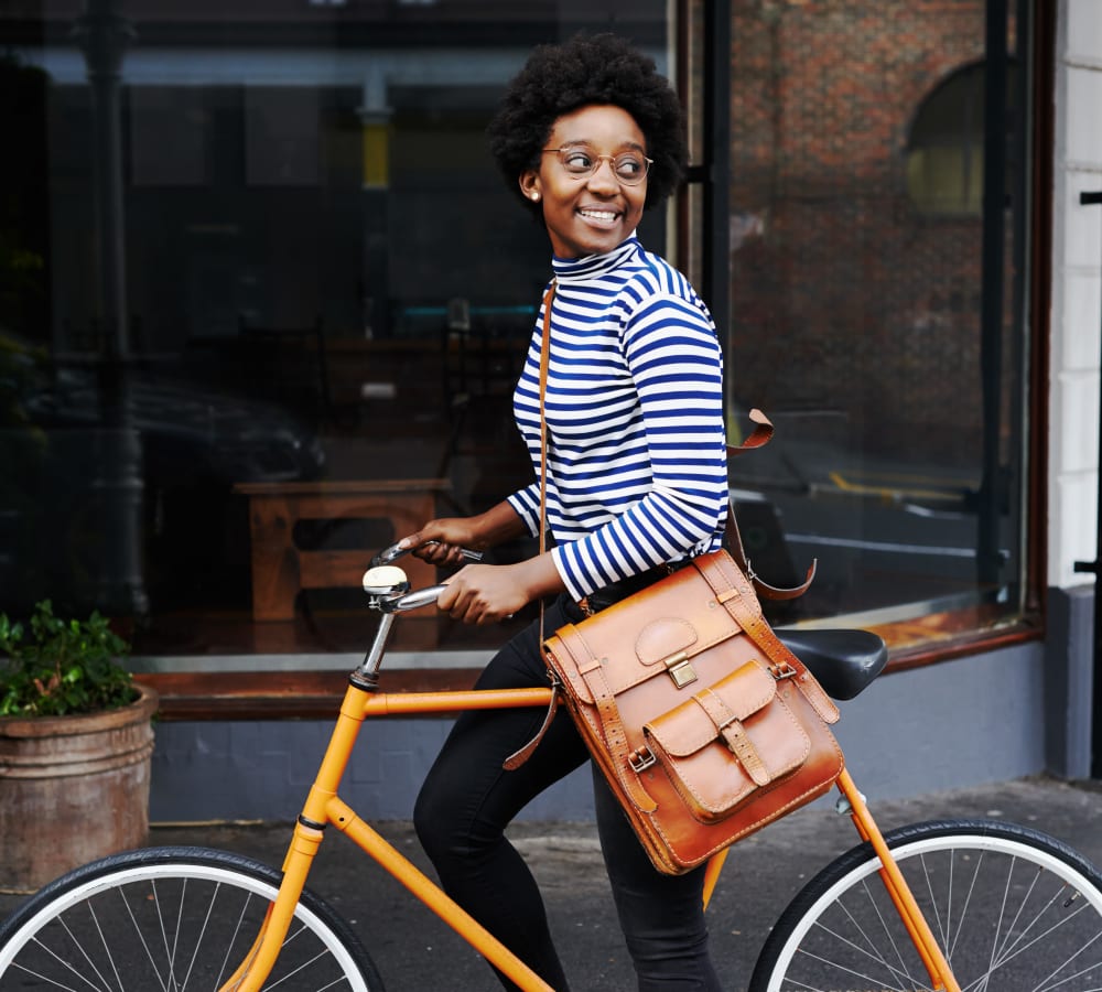Resident riding her bike through the city near at Sofi Warner Center in Woodland Hills, California