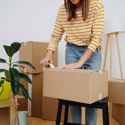 A woman packing boxes to store at Storage Star Folsom in Folsom, California