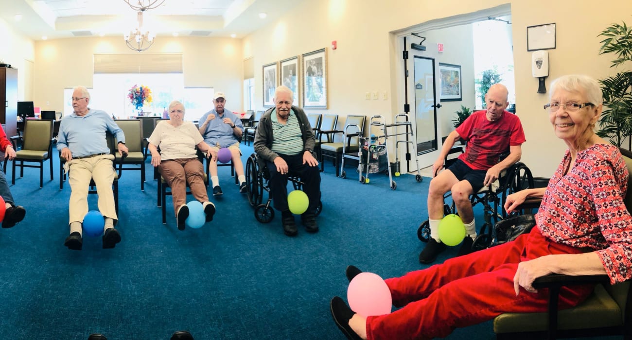 Residents playing a game at CERTUS Premier Memory Care Living in Vero Beach, Florida.