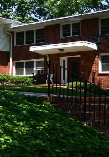 Green exterior at Royal Court Apartments in River Edge, New Jersey