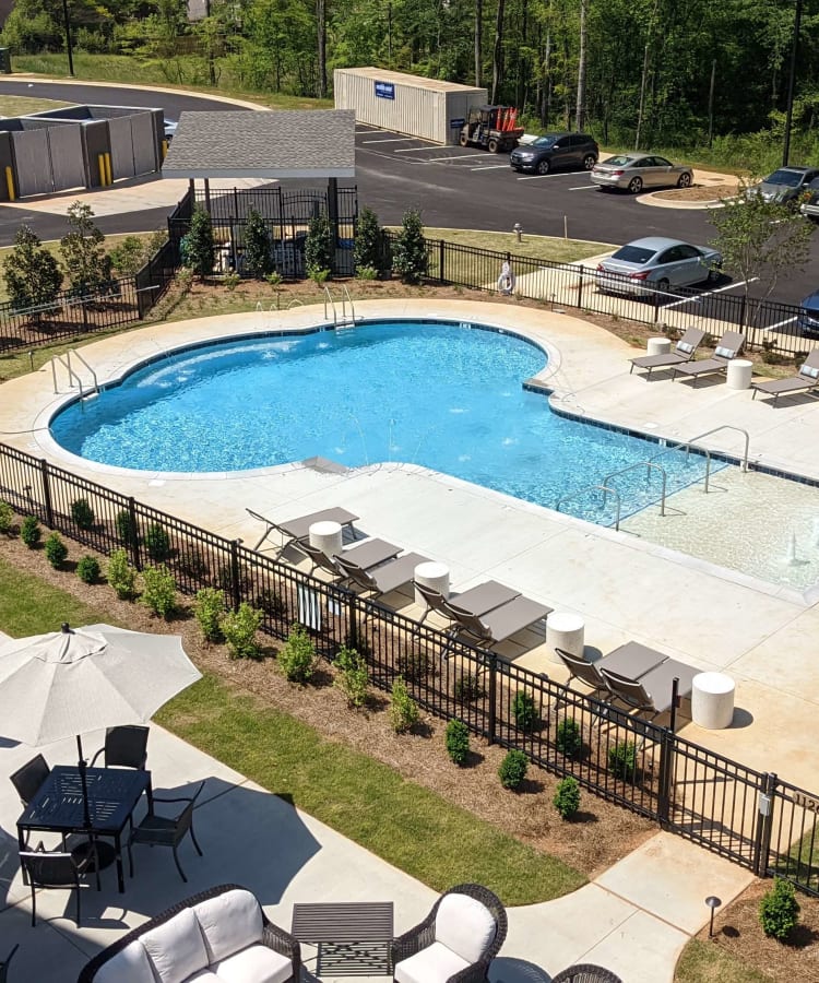 Outside view of the swimming pool at Monark Grove Madison in Madison, Alabama