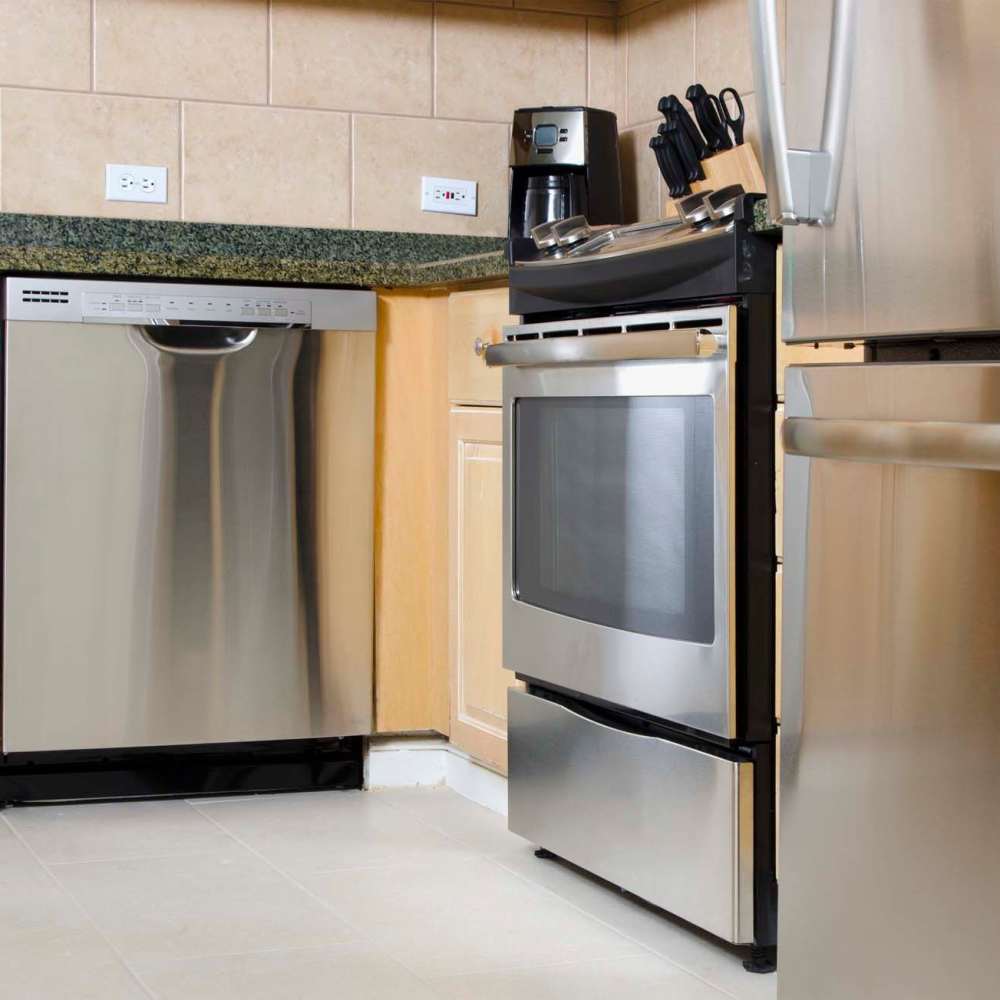 Modern kitchen with stainless-steel appliances at Coddington Point in Newport, Rhode Island