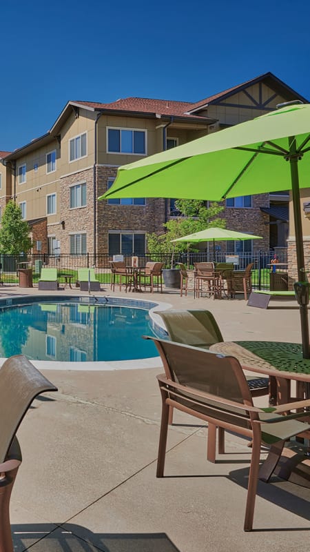 Pool area with lounges at M2 Apartments in Denver