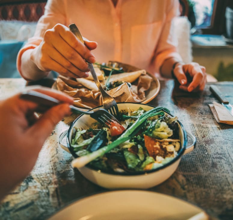 First person point of view, sharing a meal with a friend.