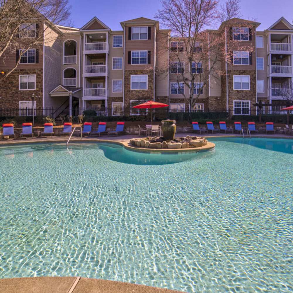 Lounge chairs beside the pool at Avonlea Towne Lake in Woodstock, Georgia
