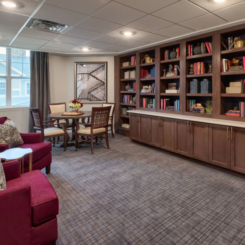 Sitting area with large bookcases at Anthology of Meridian Hills in Indianapolis, Indiana
