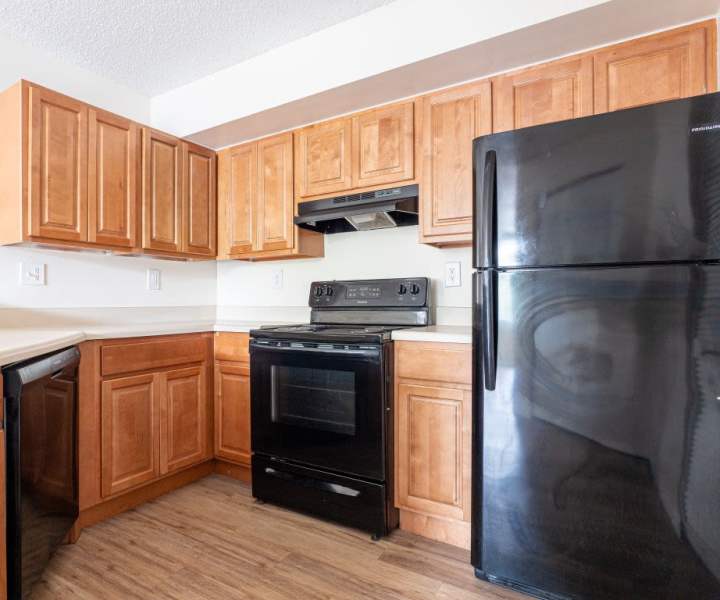 Refrigerator in kitchen at Logan Heights in Sanford, Florida