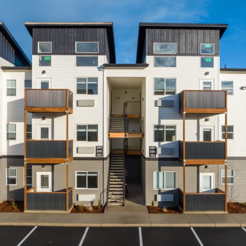 Building exterior with private balconies at Cherry City Crossing in Keizer, Oregon