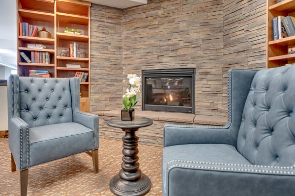 Resident lounge with cozy fireplace at Mountain Lakes Estates in Reno, Nevada.