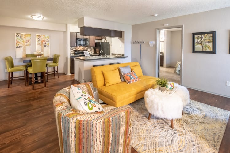 Open concept floor plan with hardwood floors and modern decor at Trails of Towne Lake in Irving, Texas