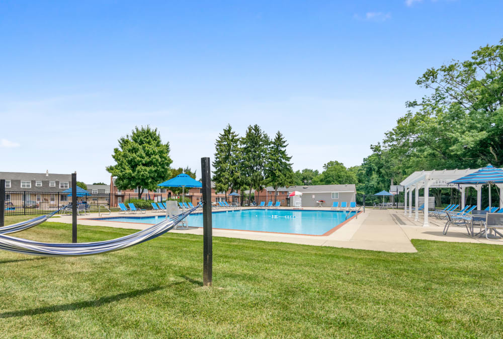 Hammocks by the pool at Roberts Mill Apartments & Townhomes in Maple Shade, New Jersey