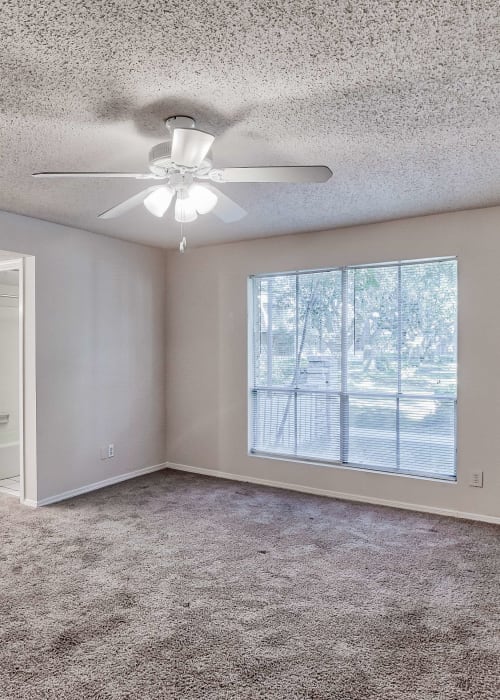 Bedroom with plush carpeting at Maison Imperial in Mobile, Alabama