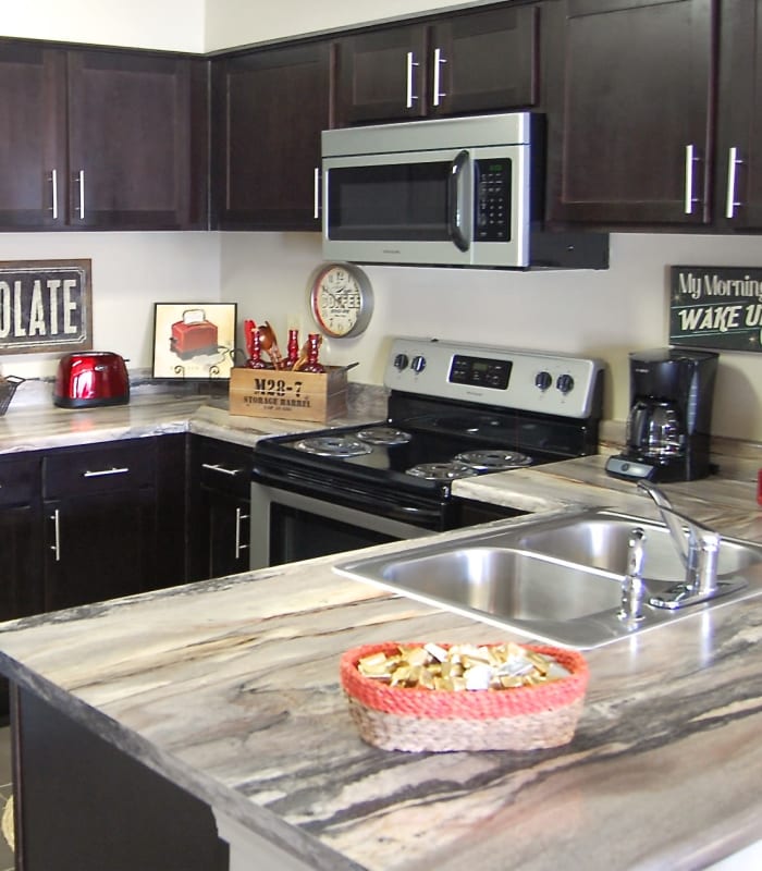 Kitchen with granite countertops at Park at Coulter in Amarillo, Texas