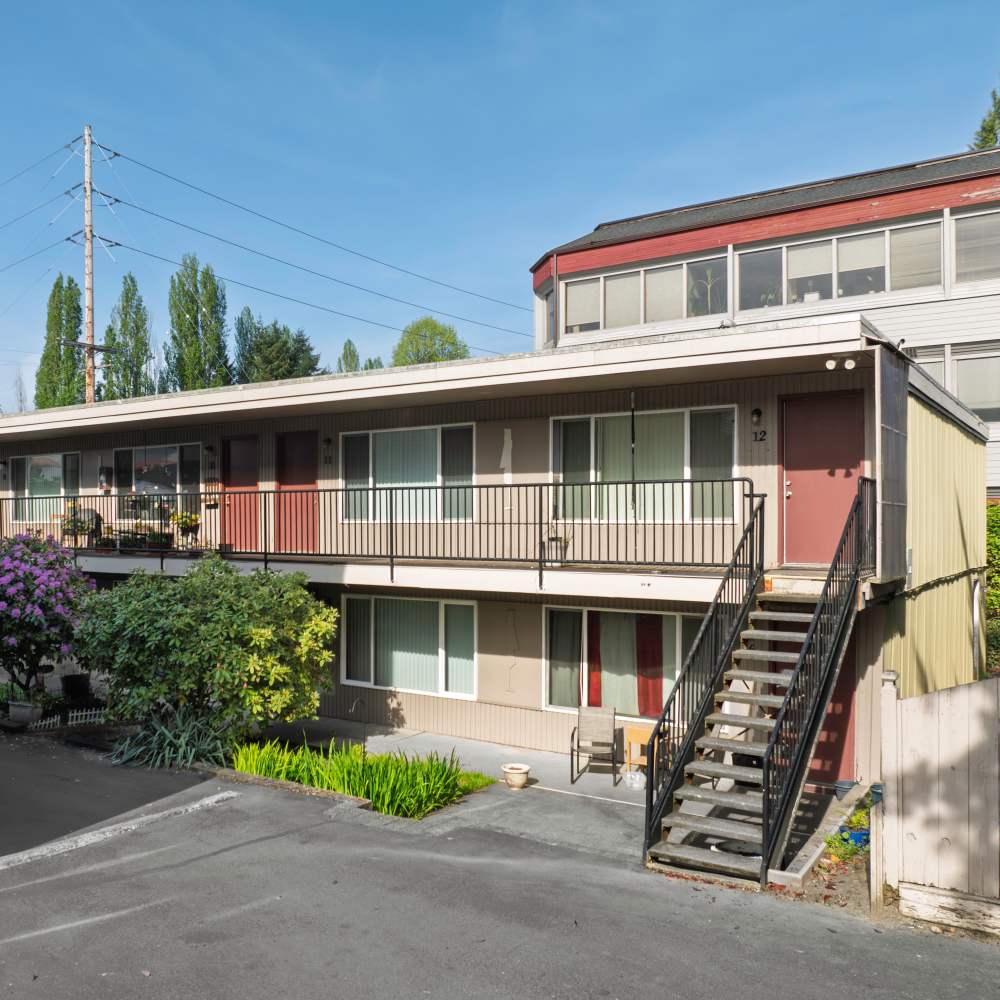 View of building with stairs to top floor at Brentwood Apartments in Olympia Washington