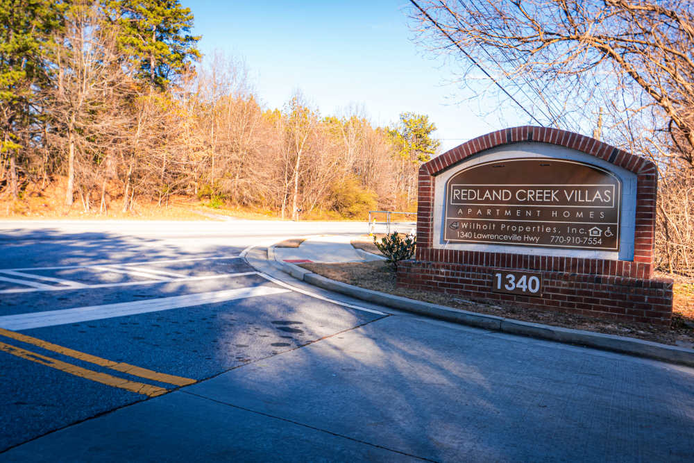 Property signage board at entrance at Redland Creek in Lawrenceville, Georgia 