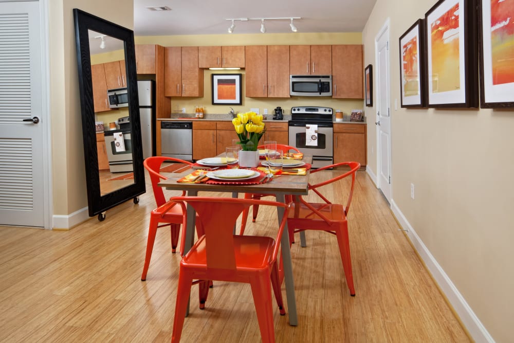 Open concept dining area and kitchen in a model apartment home at Cielo in Charlotte, North Carolina