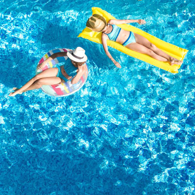 Residents floating in a pool at Albany Hill Village in Albany, Georgia