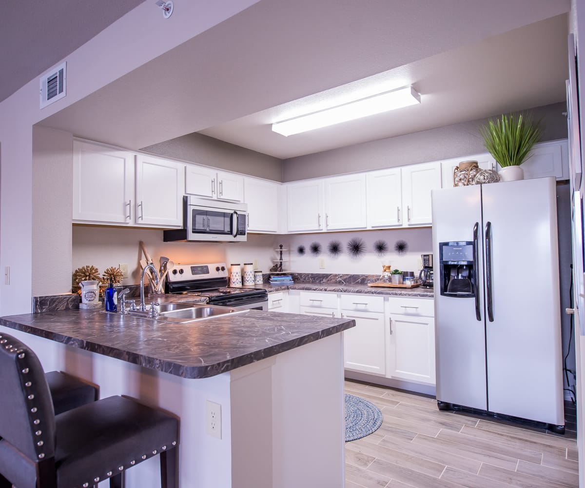 Kitchen with stainless steel appliances at Scissortail Crossing Apartments in Broken Arrow, Oklahoma