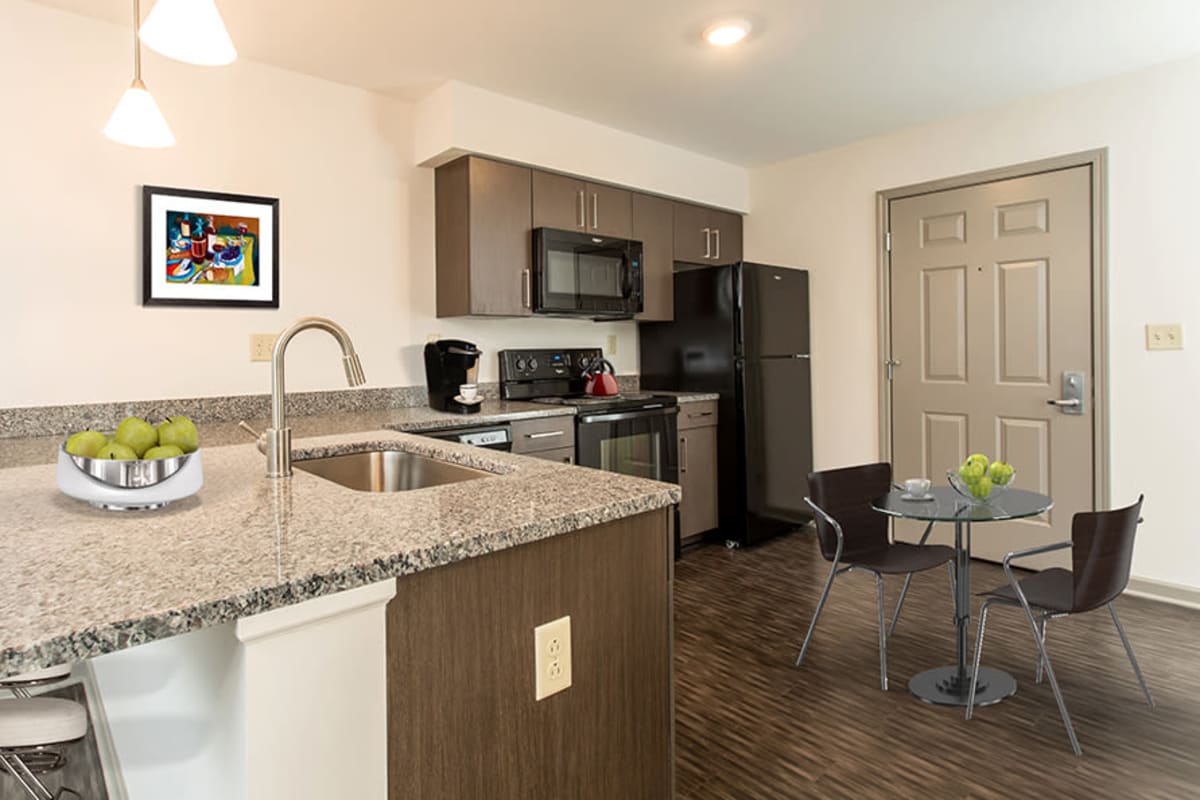 Kitchen and dining area at Greenwood Cove Apartments in Rochester, New York