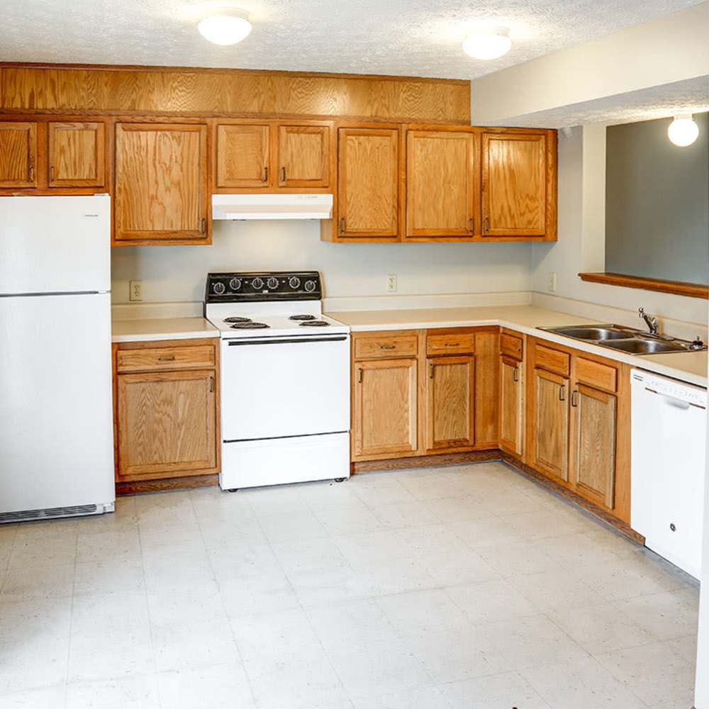 Modern kitchen with sleek white appliances at Fox Run Crossing in Piketon, Ohio