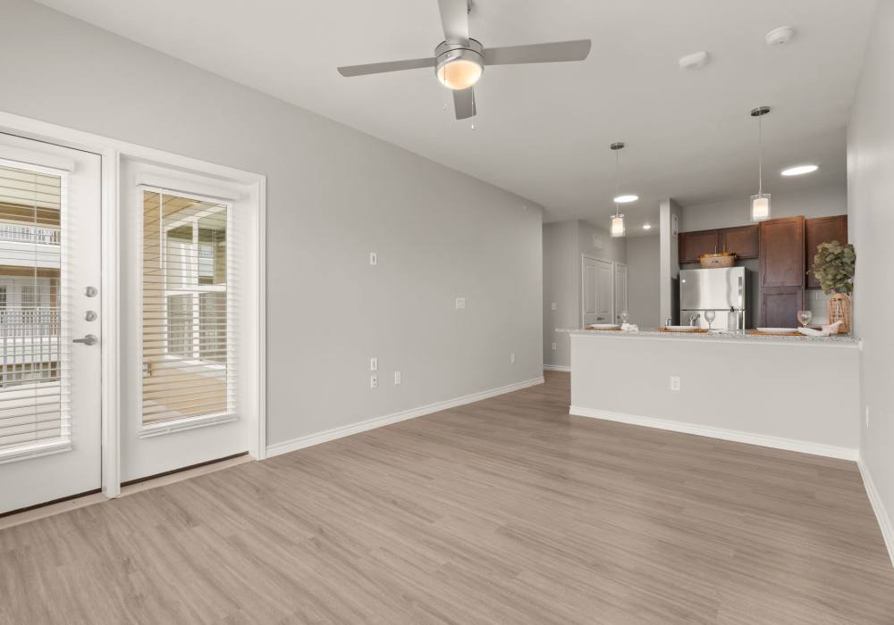 Open living room with kitchen at Walnut Springs in Seguin, Texas