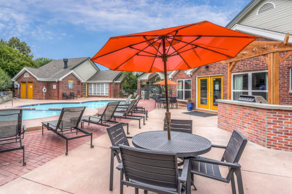 Dining place near to the swimming pool at Keystone Apartments in Northglenn, Colorado