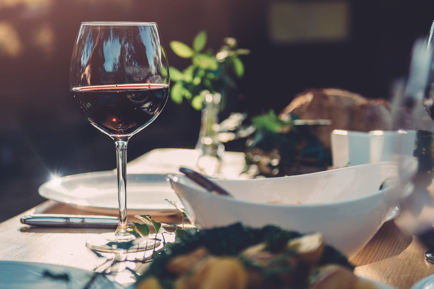 A glass of wine sitting on a well decorated table near The Preserve at Forbes Creek in Kirkland, Washington