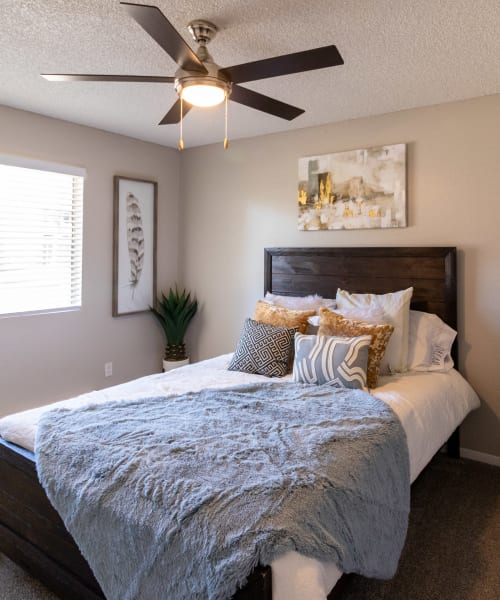 Bedroom with ceiling fan at Keyway Apartments in Sparks, Nevada