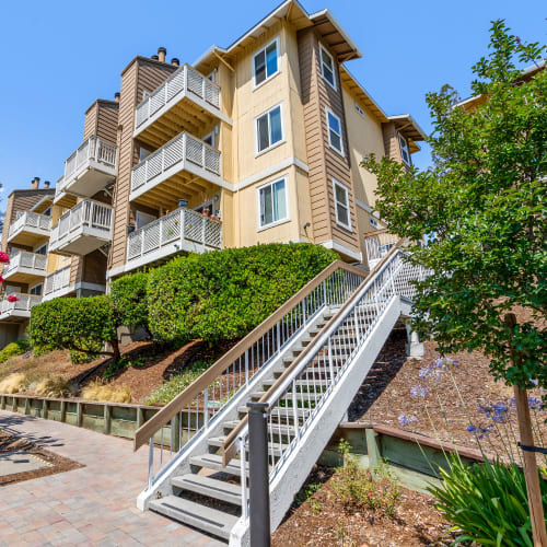 Stairs and walkway on the park-like grounds at Quail Hill Apartments in Castro Valley, California