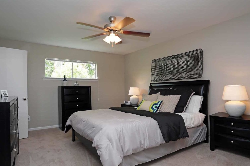 Main bedroom with modern furnishings at Brittany Place Apartments in Houston, Texas