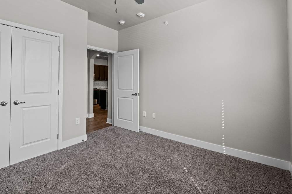 Bedroom at Pebble Brook Apartments in Jacksonville, Texas