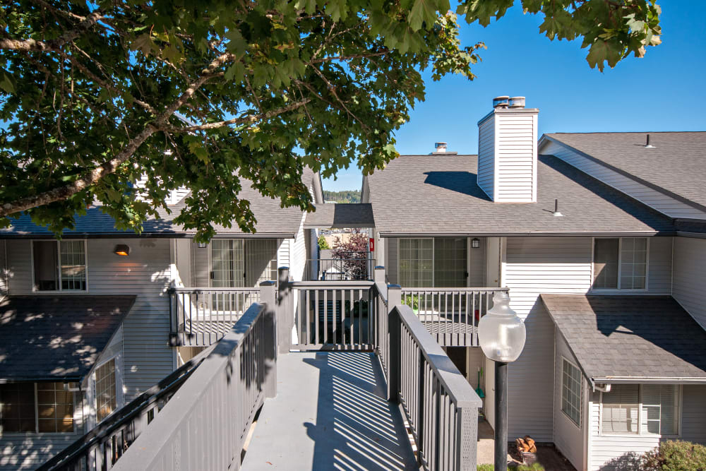 The sunny walkways between apartments at Wellington Apartment Homes in Silverdale, Washington